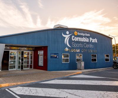 Entrance to the blue Cornubia Park Sports Centre with signage