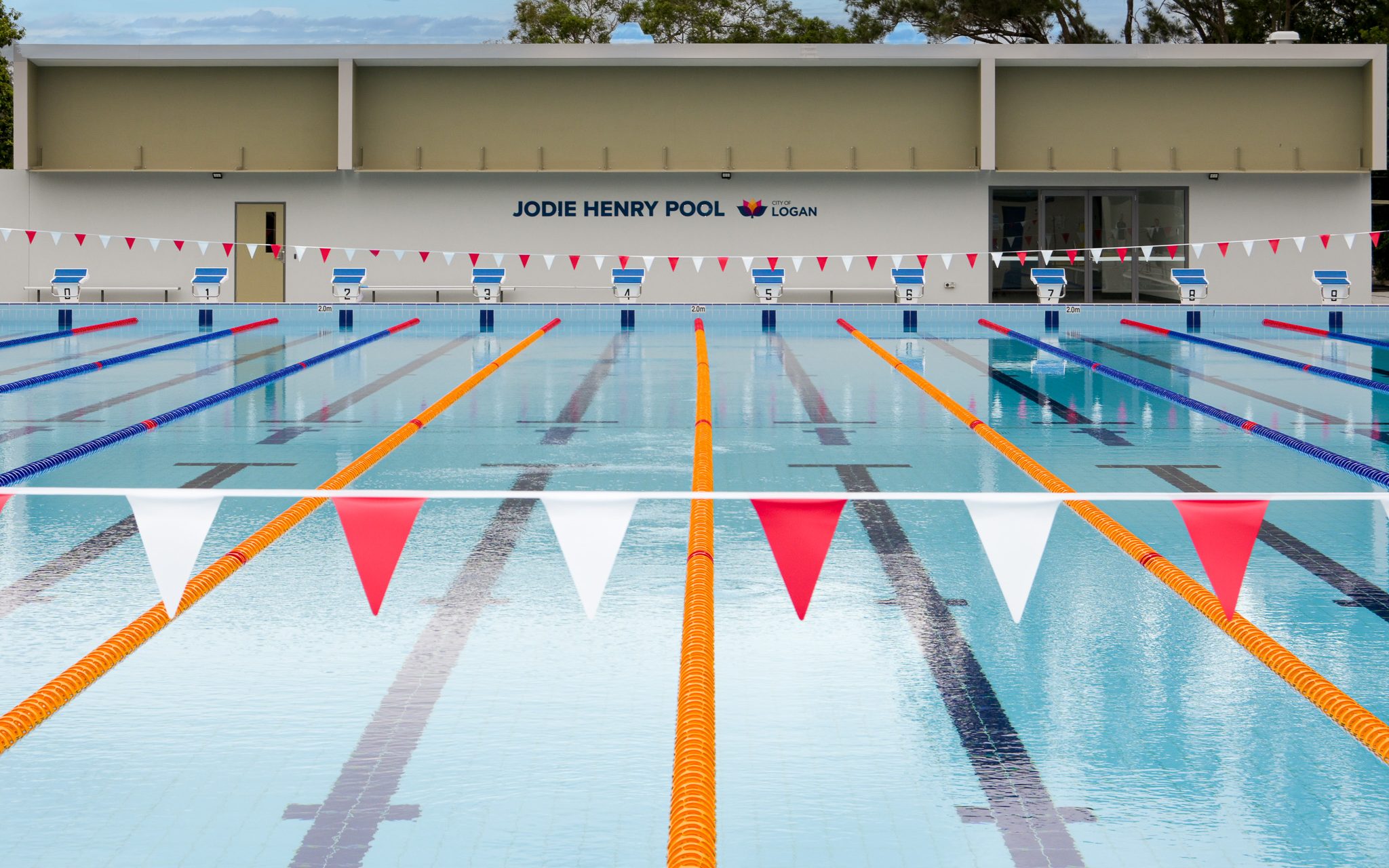 Jodie Henry pool sign centred behind outdoor pool